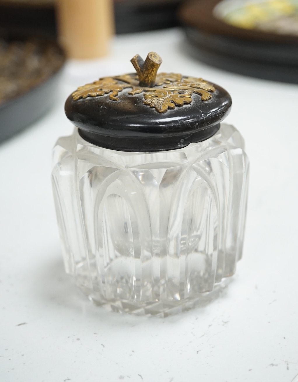 A Victorian ebonised and brass overlaid inkstand with cut glass ink well, 27cm wide. Condition - poor